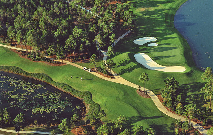 aerial view of golf course with trees and paths at sandestin resort