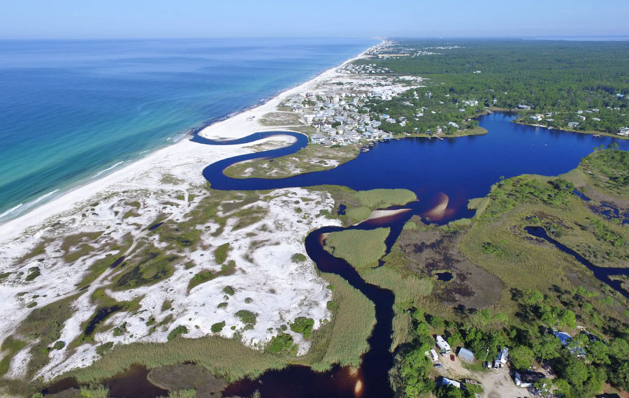 aerial view over coastline and estuary at grayton beach state park miramar 30a