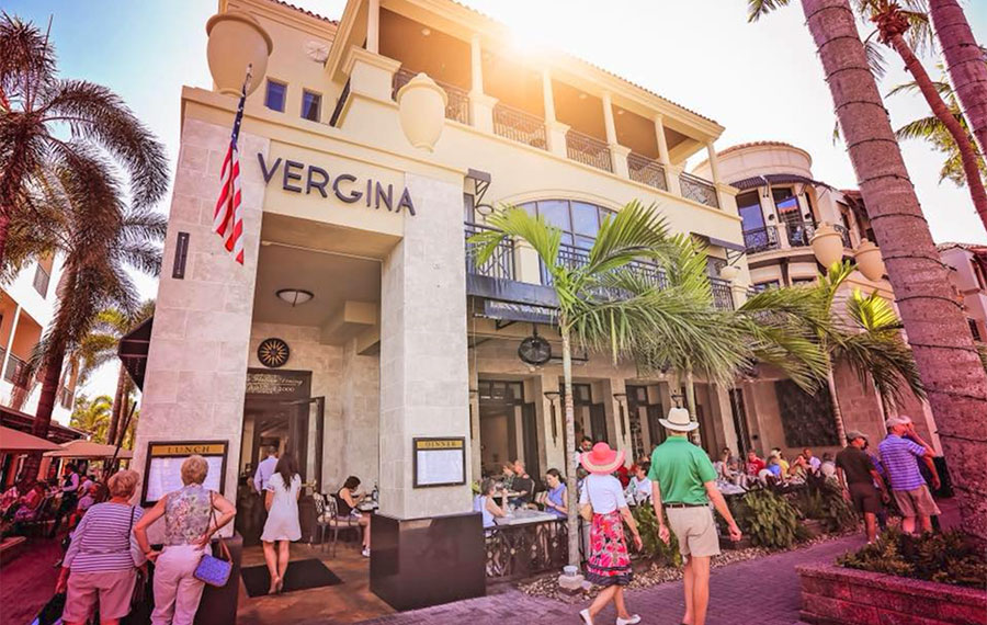 angled corner street view of restaurant vergina with sidewalk traffic naples