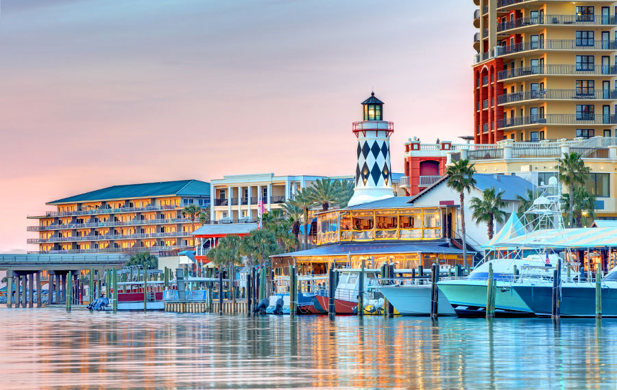 twilight view from harbor of harborwalk village destin