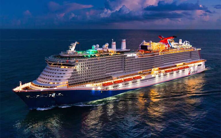 lighted cruise ship at night on sea at carnival cruise line port canaveral space coast