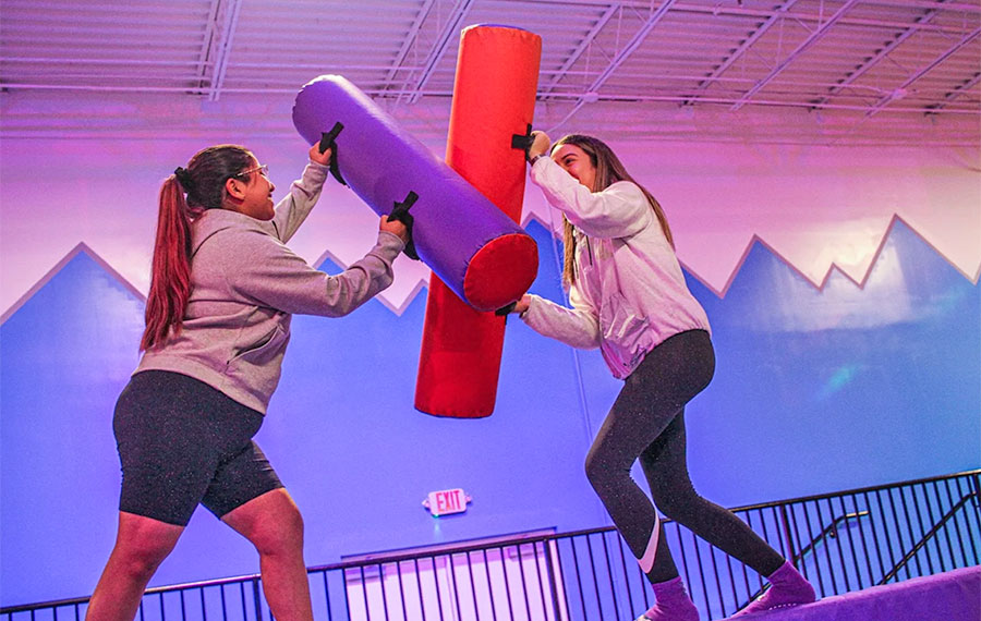 teen girls jousting over foam pit altitude trampoline park kissimmee