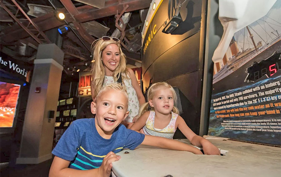 kids with mom interacting with titanic exhibit wonderworks panama city beach