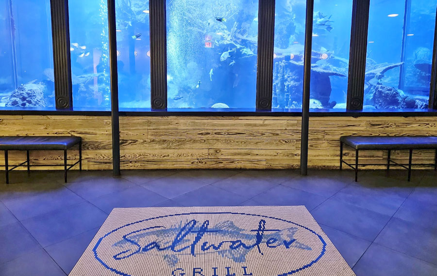 restaurant foyer with wall aquarium and floor mosaic saltwater grill panama city beach