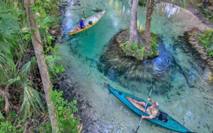 aerial view of kayaks paddling along clear creek at kings landing canoe kayak rental apopka