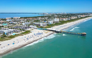 aerial view over daytime cocoa beach with westgate pier