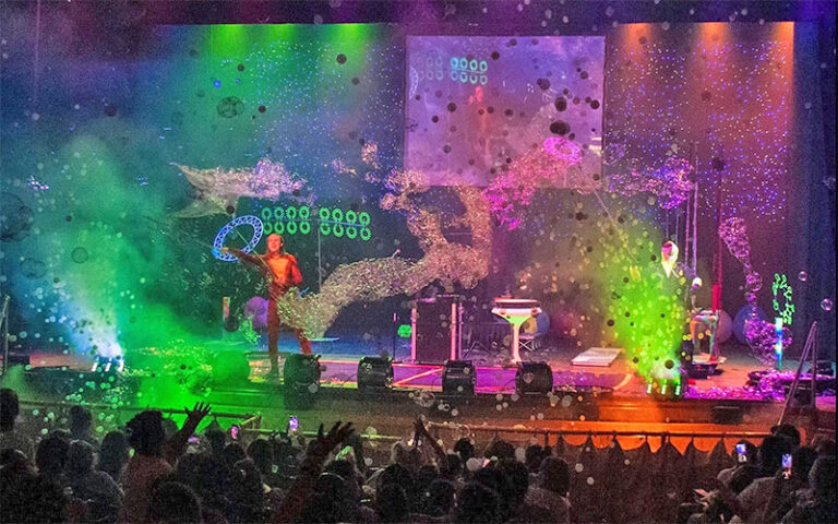 colorful stage performance with bubbles at spheres bubble show icon park orlando