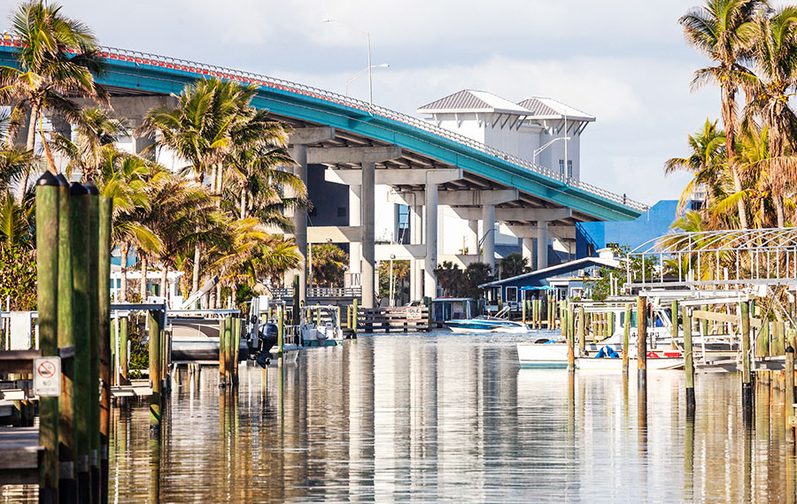 view along canal with marinas and bridge fort myers